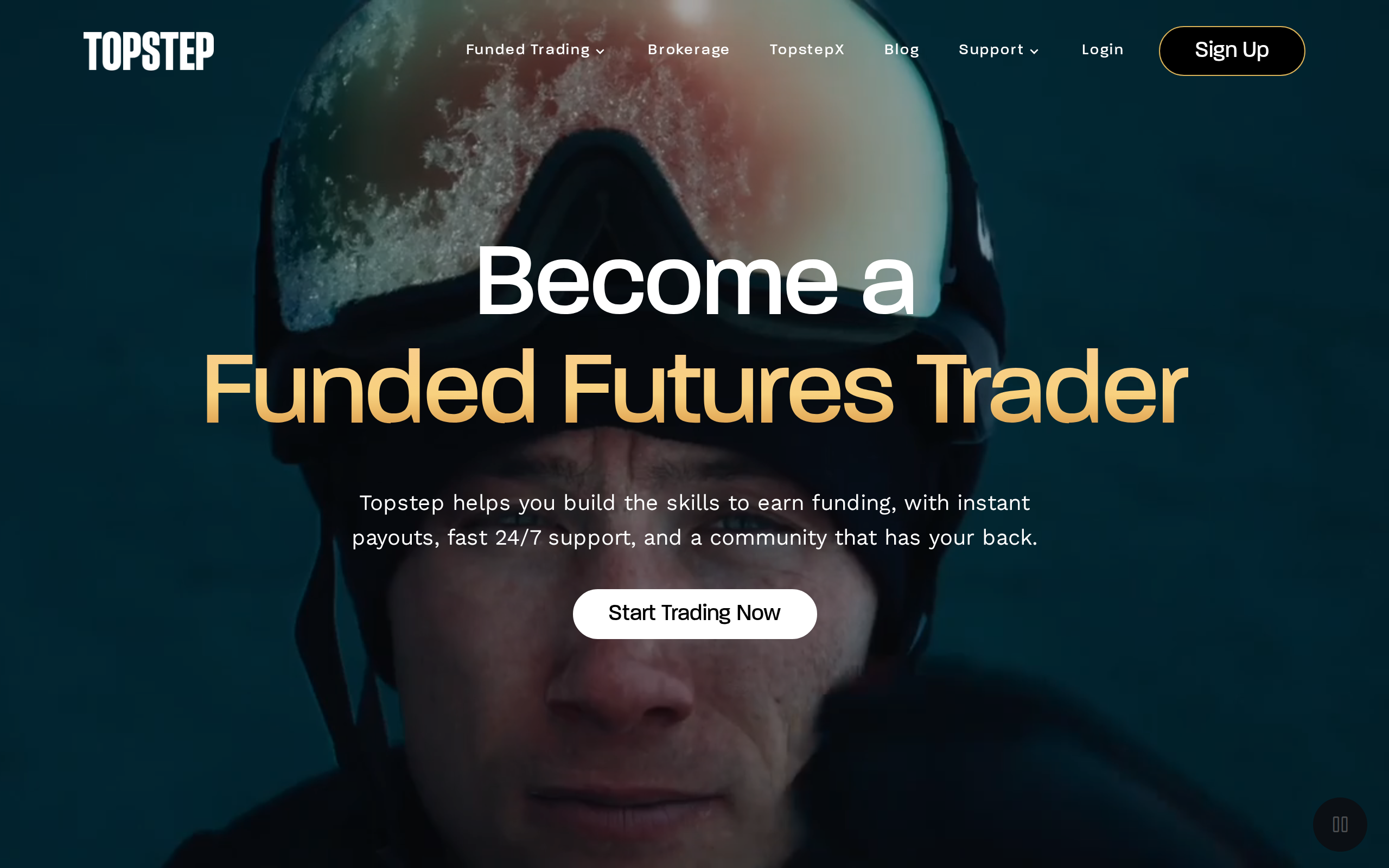 Topstep homepage with the headline Become a Funded Futures Trader over a looping video background